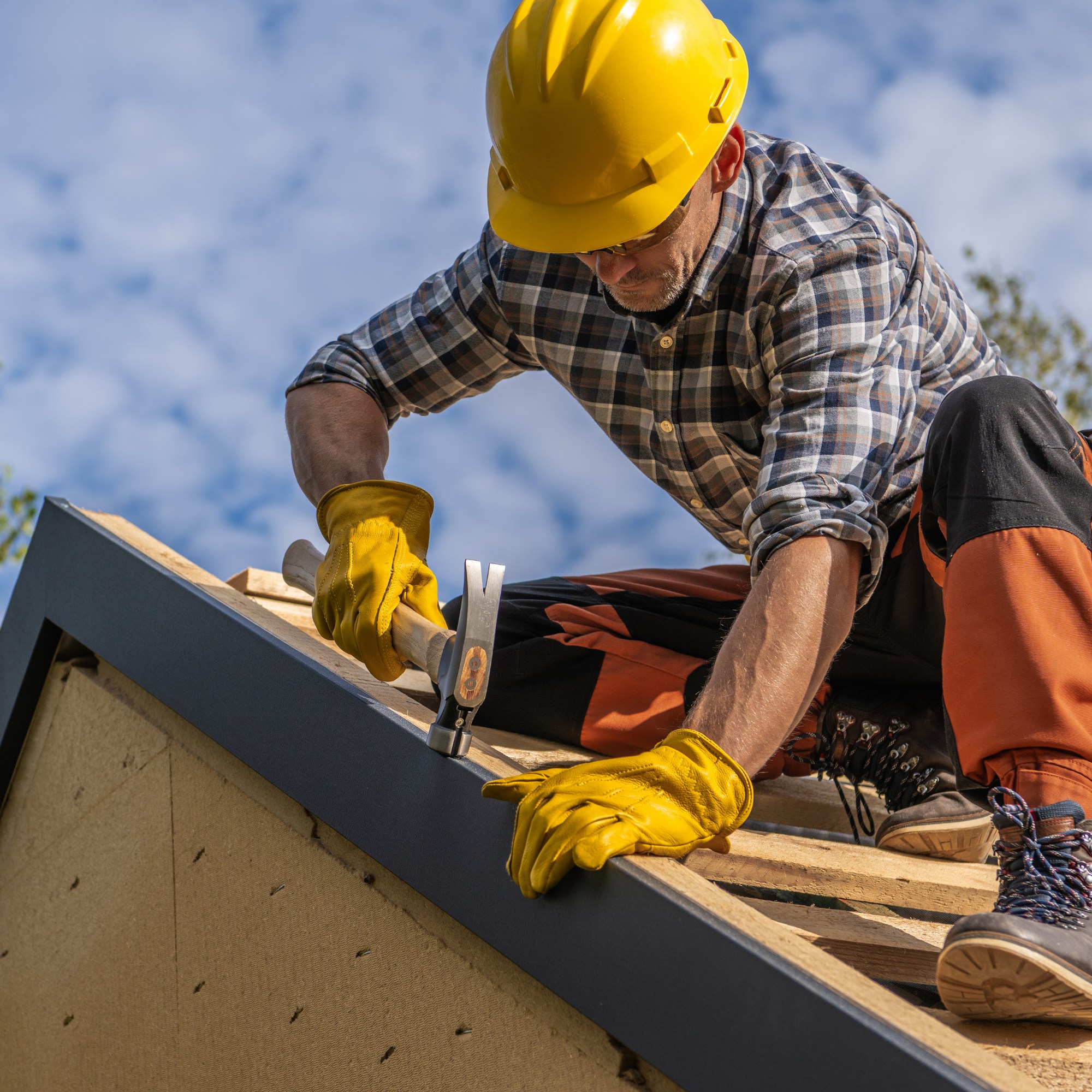 Commercial roofing contractors Adelaide — commercial roof repairs and replacement specialists inspecting a commercial metal deck roof in Adelaide, Australia