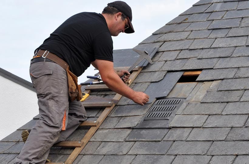 Emergency commercial roof repairs Adelaide — crew making safe a storm-damaged commercial roof at night